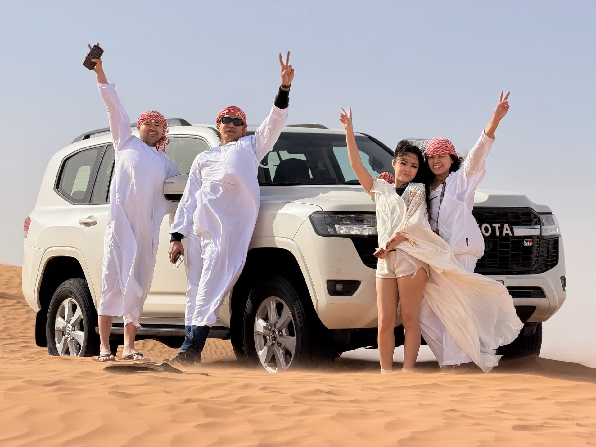 White 4x4 safari vehicle out on the dunes of the Dubai desert
